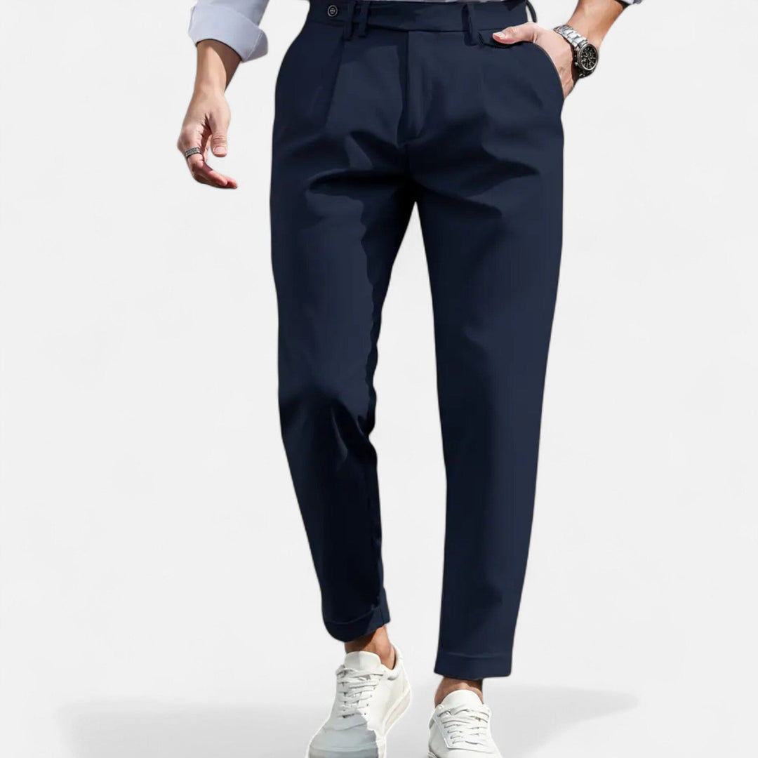  Model wearing smart slim fit trousers with a streamlined silhouette on a plain background.