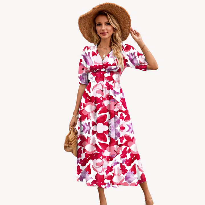 Model in a floral print tie waist midi dress with elegant V-neckline on a clean background.