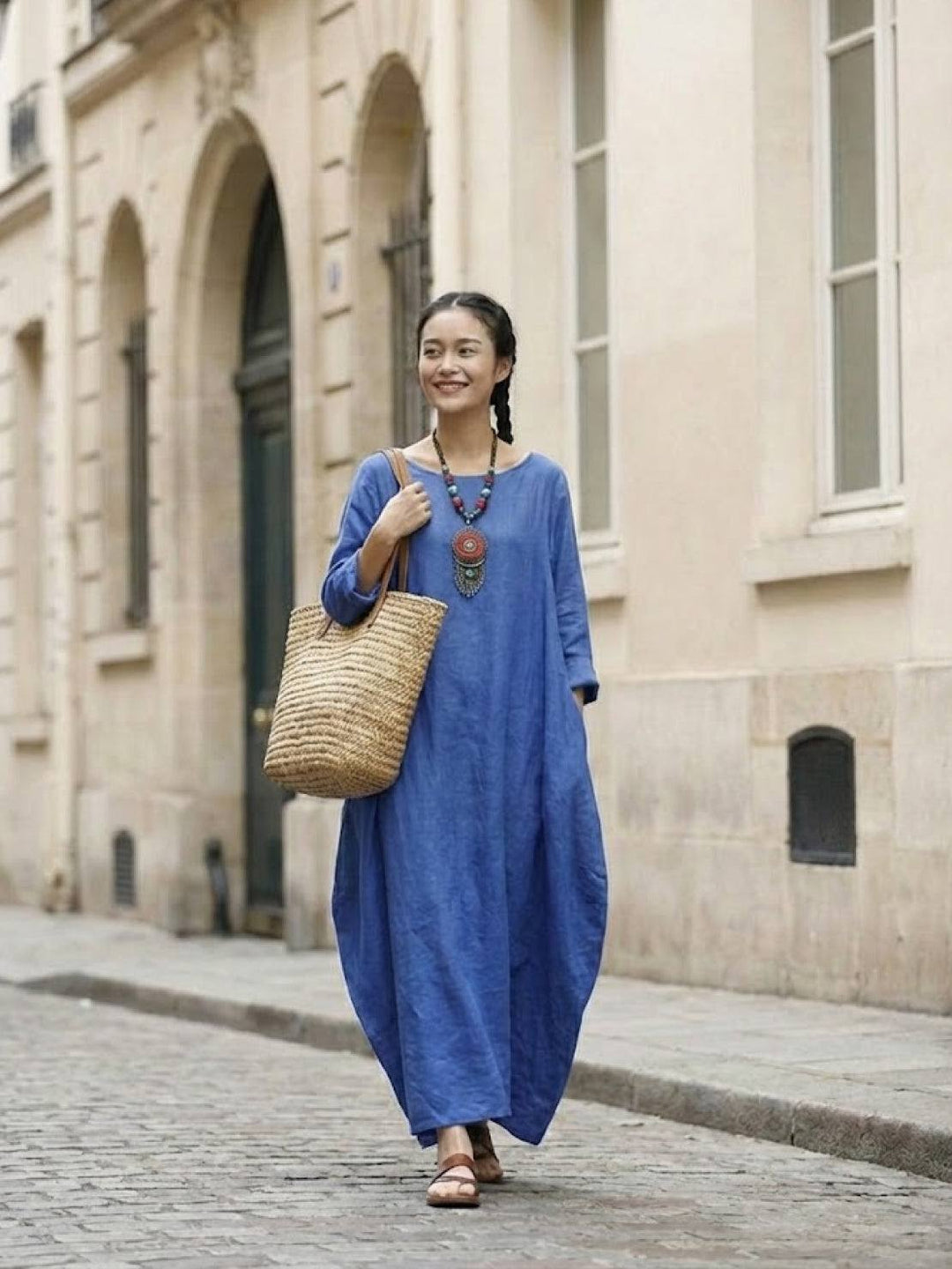 Full-length casual dress with soft drape photographed on a plain background.