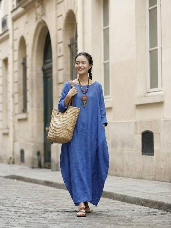 Full-length casual dress with soft drape photographed on a plain background.