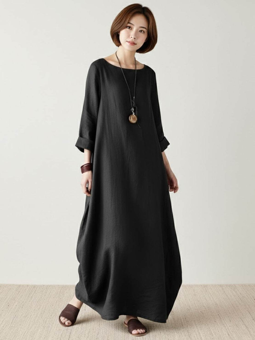 Full-length relaxed dress with airy styling displayed on a plain background.