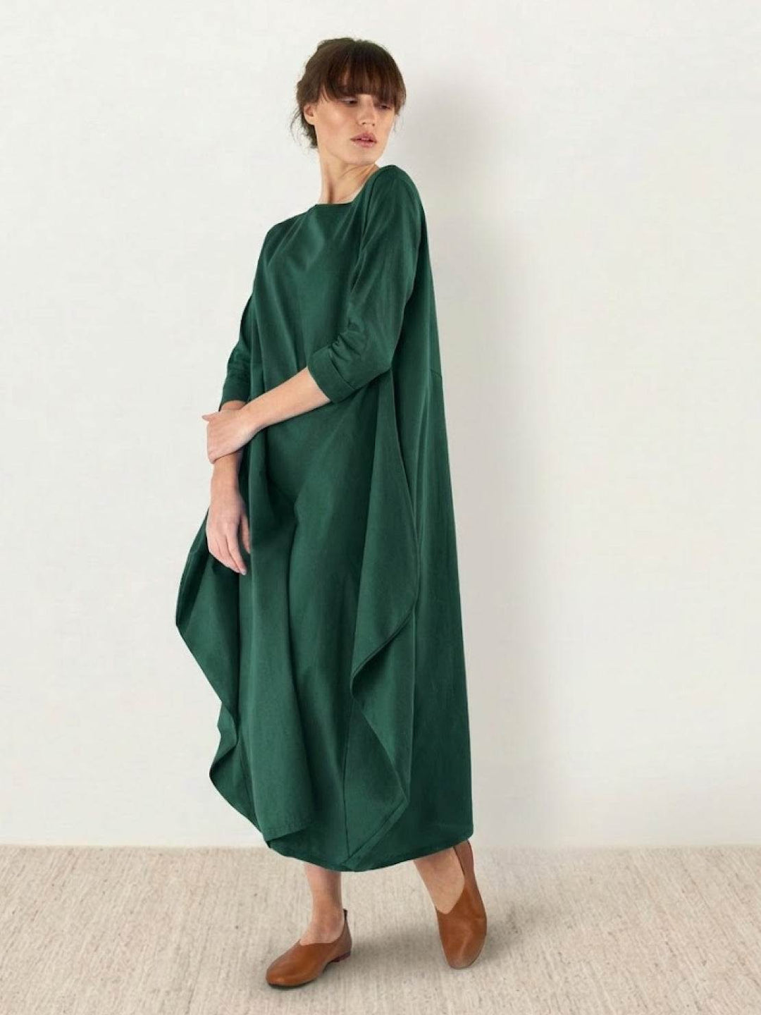 Casual maxi dress with loose draped fit displayed on a plain background.