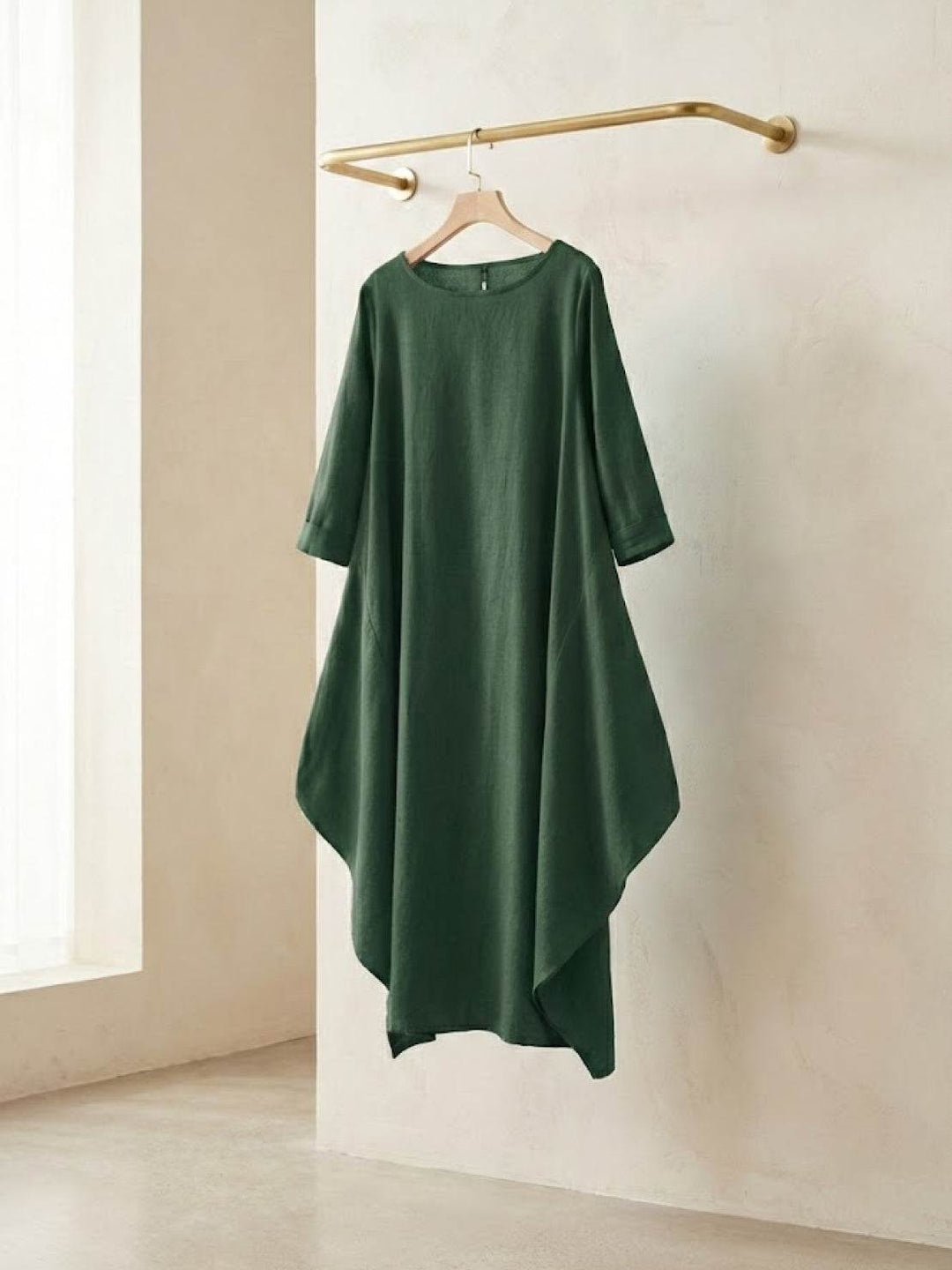 Woman in a loose draped dress designed for warm days.
