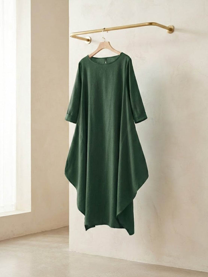 Woman in a loose draped dress designed for warm days.