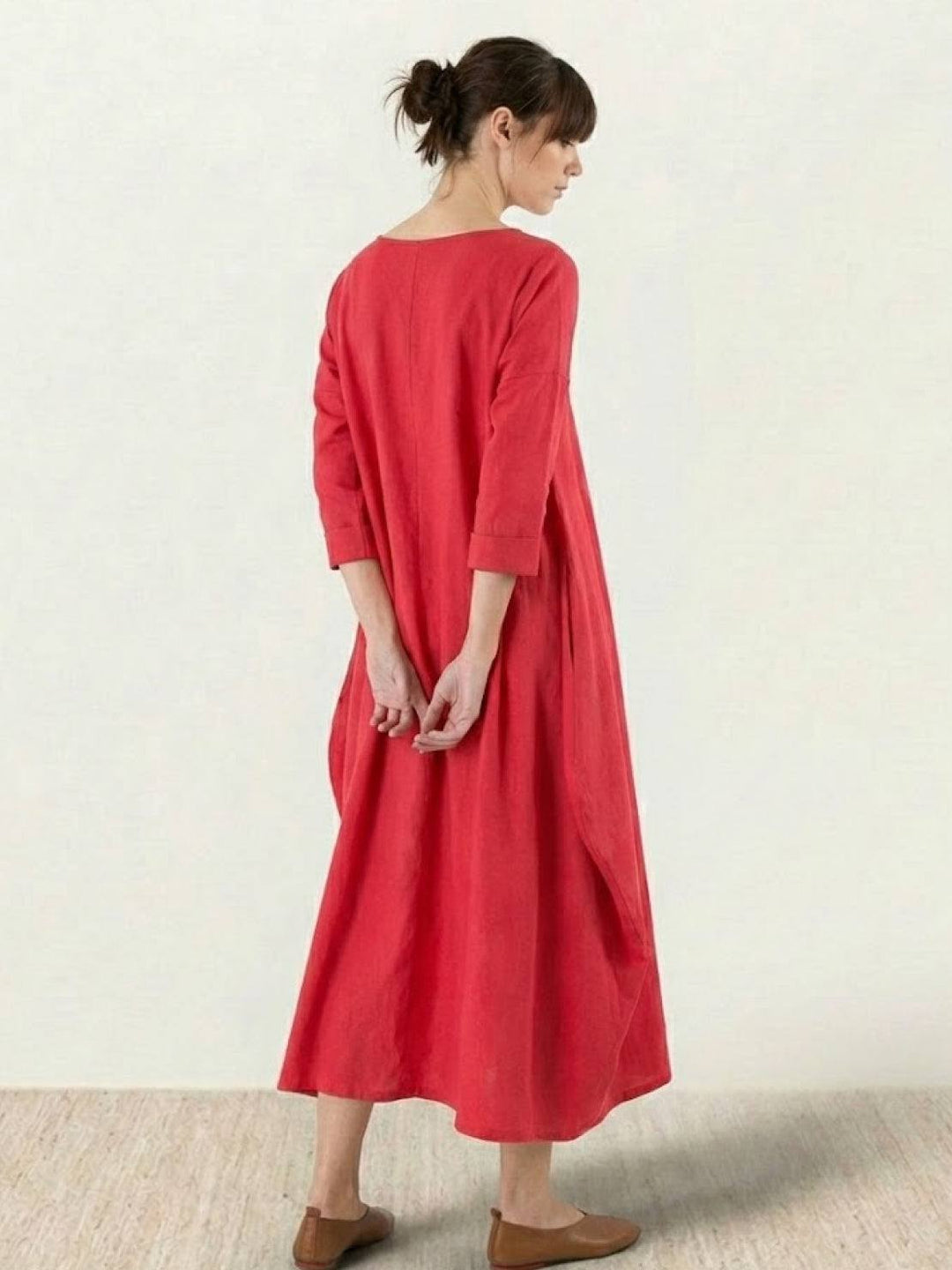 Female model presenting a flowing maxi dress with everyday styling.