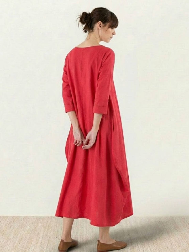Female model presenting a flowing maxi dress with everyday styling.