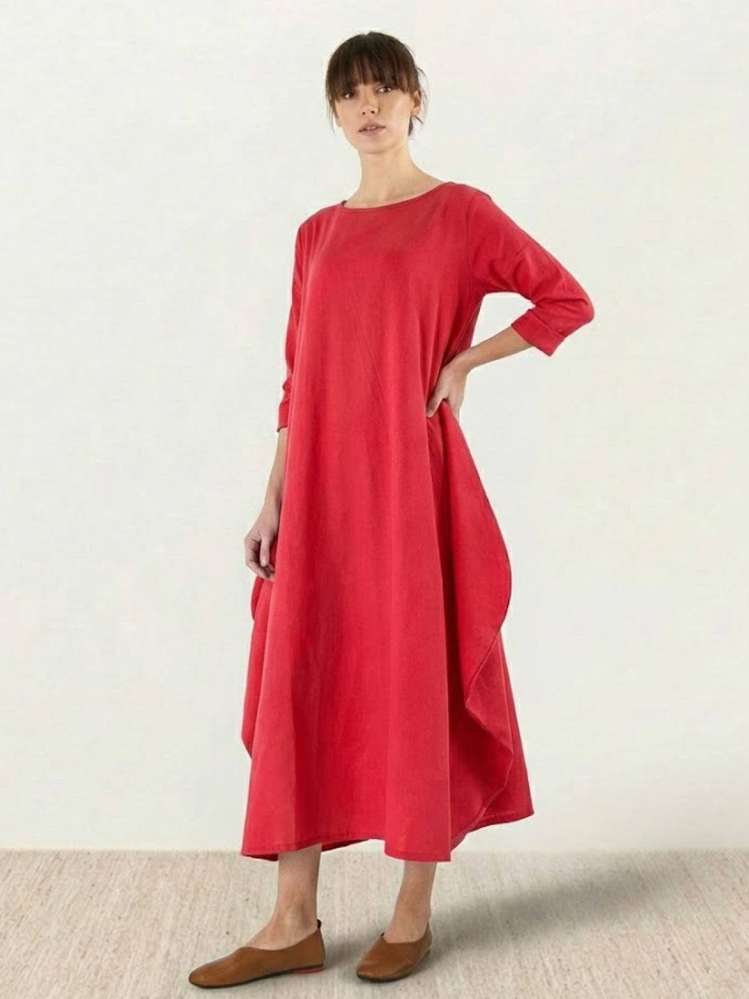 Loose-fit dress with full-length hem shown against a plain background.