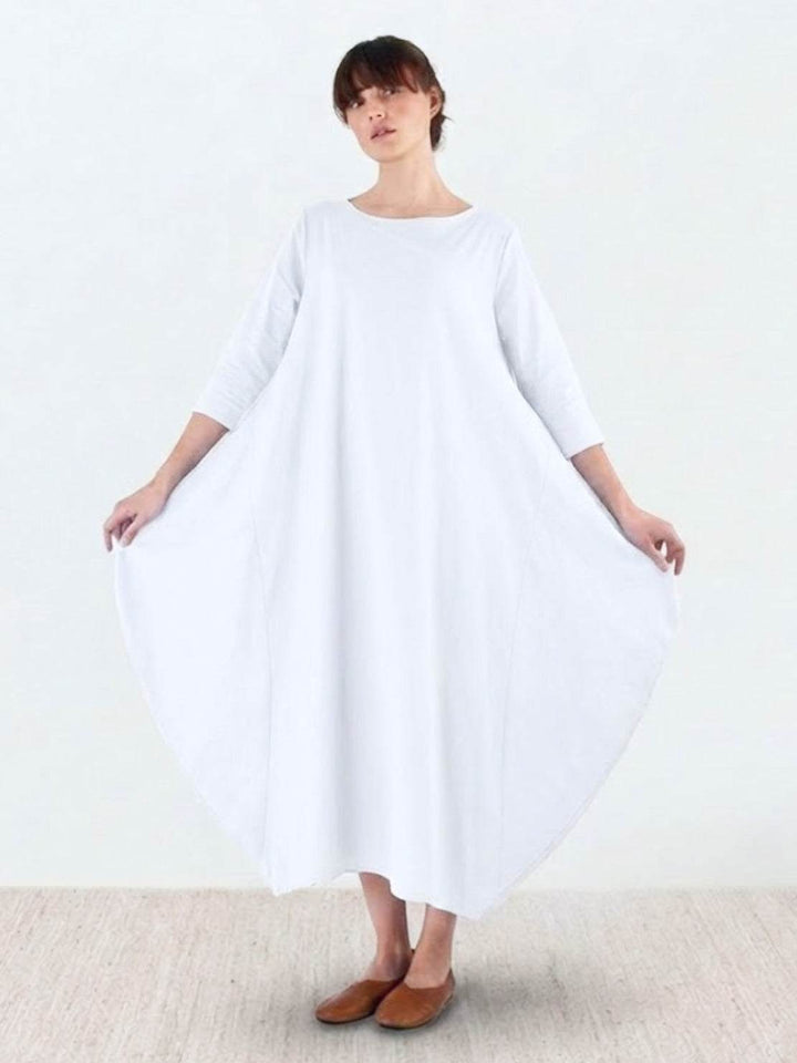 Woman wearing a lightweight-look maxi dress with comfortable loose sleeves.