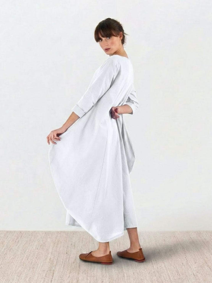 Female model showcasing a comfortable loose dress with simple silhouette.