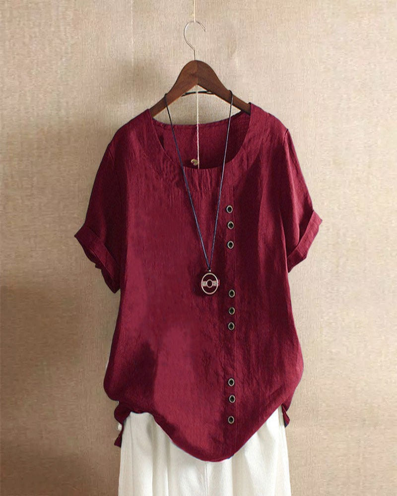 Relaxed fit blouse displayed from right angle plain background.