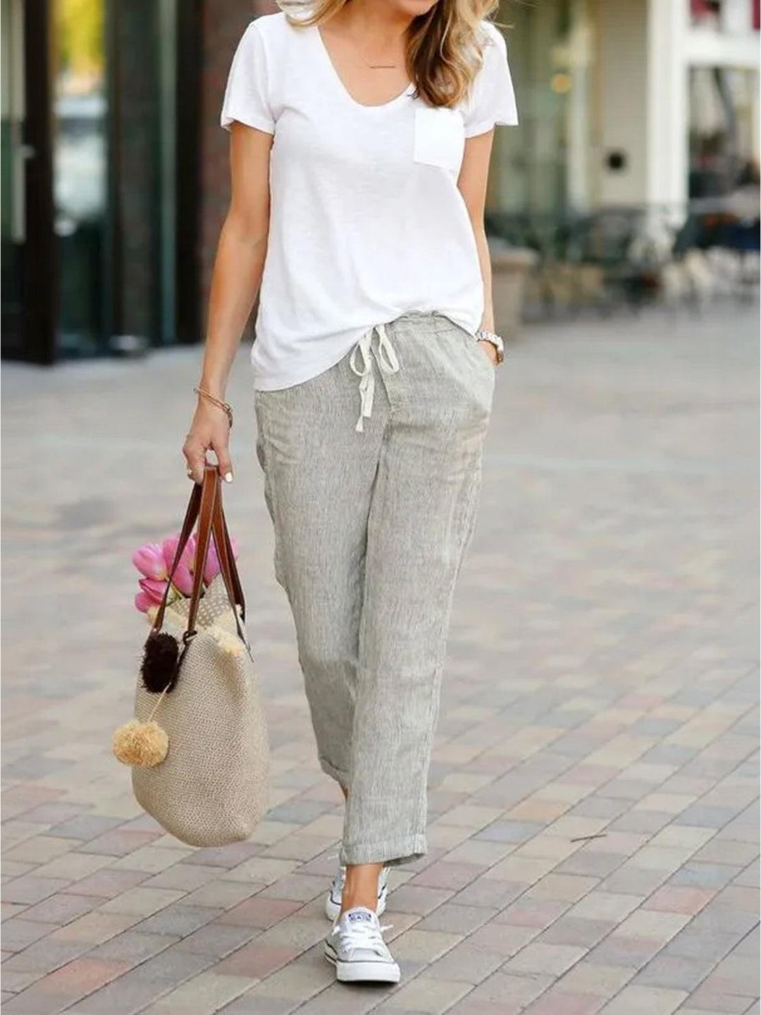 Women’s tapered drawstring pants shown on a plain background with a relaxed hip fit.