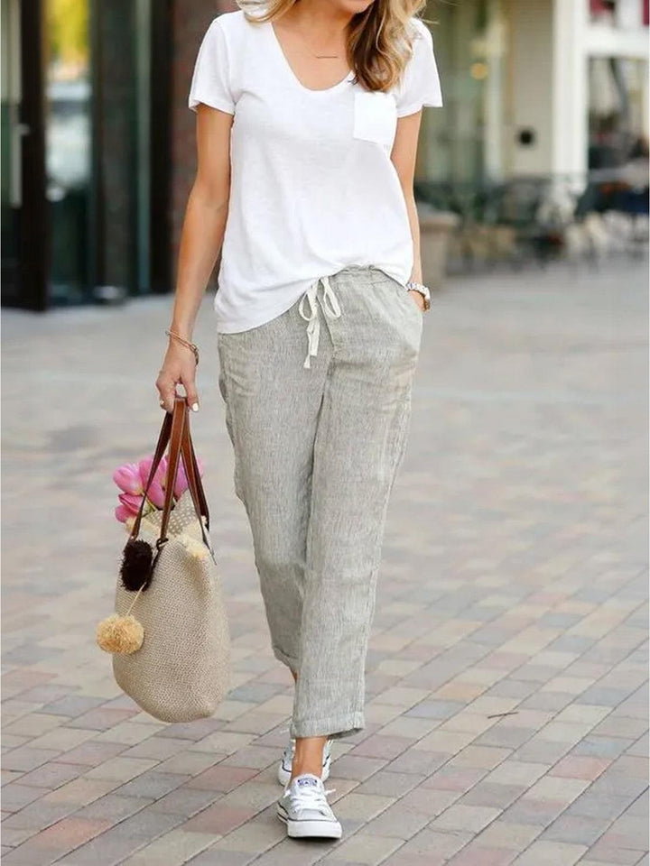 Women’s tapered drawstring pants shown on a plain background with a relaxed hip fit.