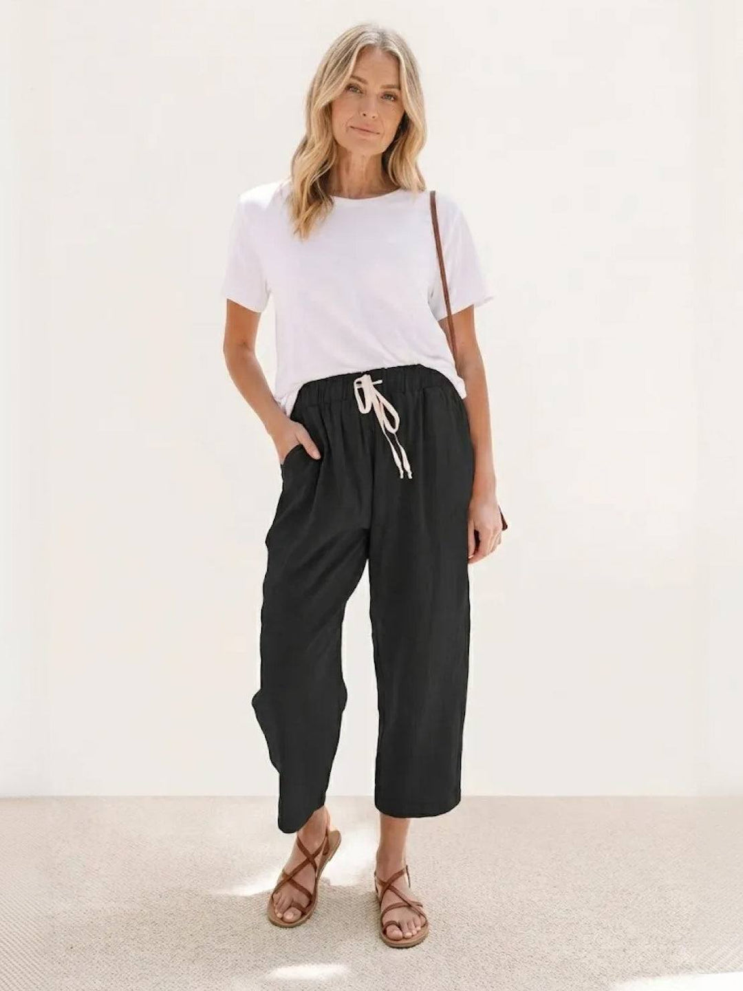 Lightweight women’s drawstring pants displayed on a plain background for daily wear.