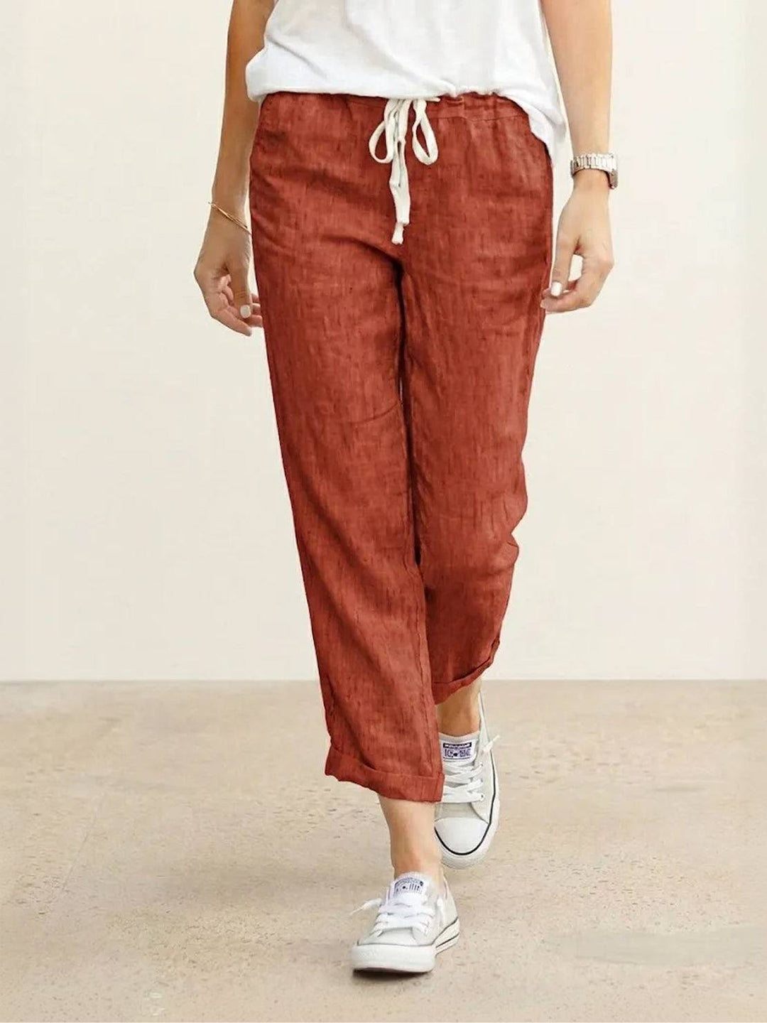 Women’s ankle-length tapered pants with drawstring waist shown on a plain background.