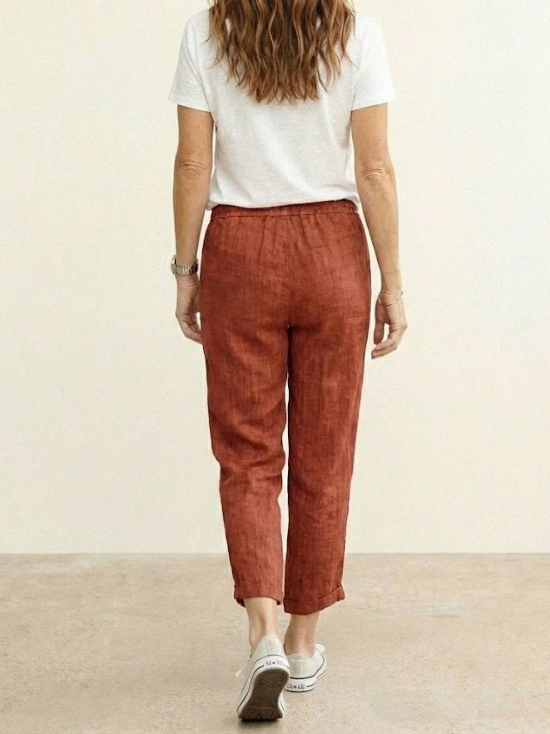 Casual women’s pull-on trousers with pockets displayed on a plain background.