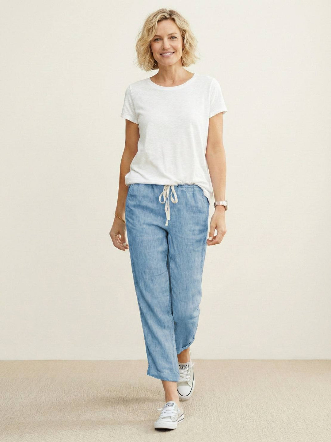 Casual women’s ankle pants displayed on a plain background with a tapered leg design.