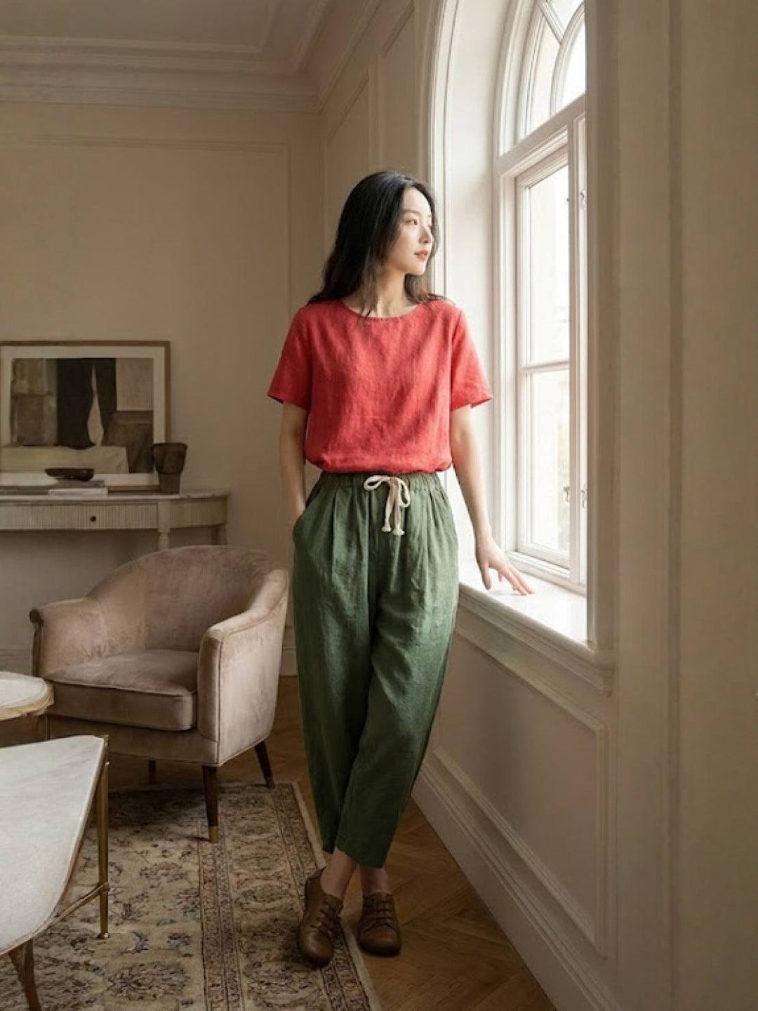 Women’s pull-on tapered pants on a living room background for simple everyday dressing.