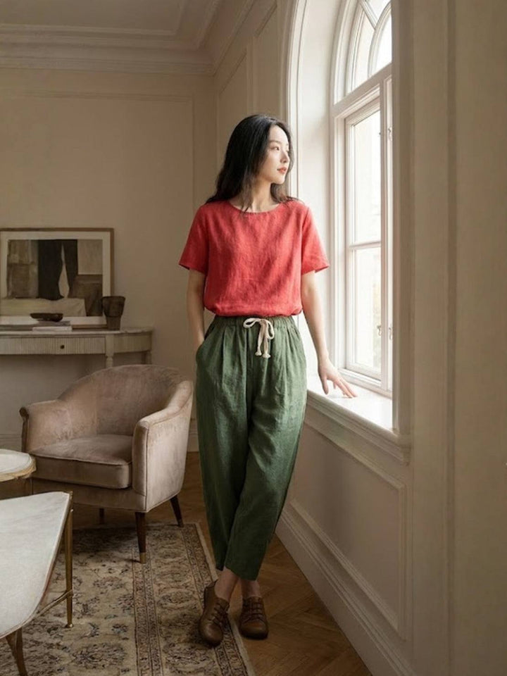 Women’s pull-on tapered pants on a living room background for simple everyday dressing.