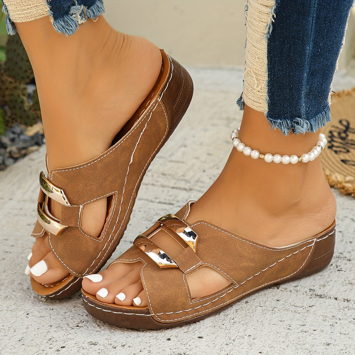 Foot model showing flexible sole slide sandals on a clean background.