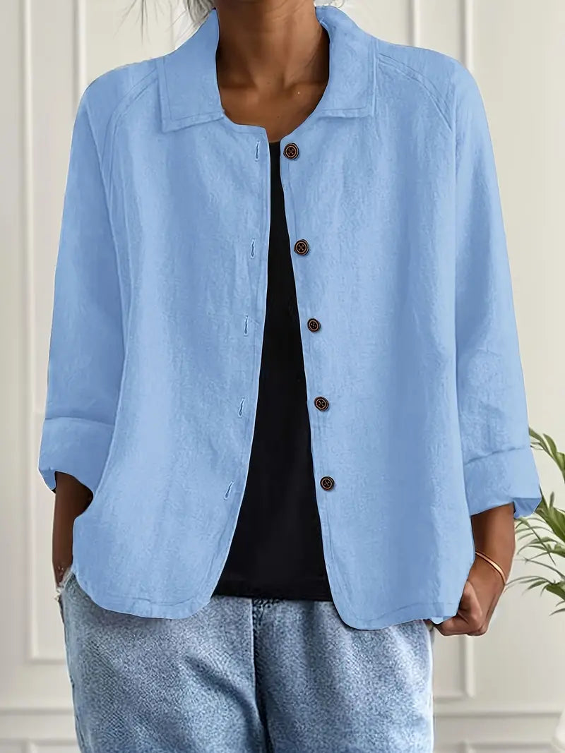 Woman wearing a lightweight classic top on a clean background with a soft flattering fit.