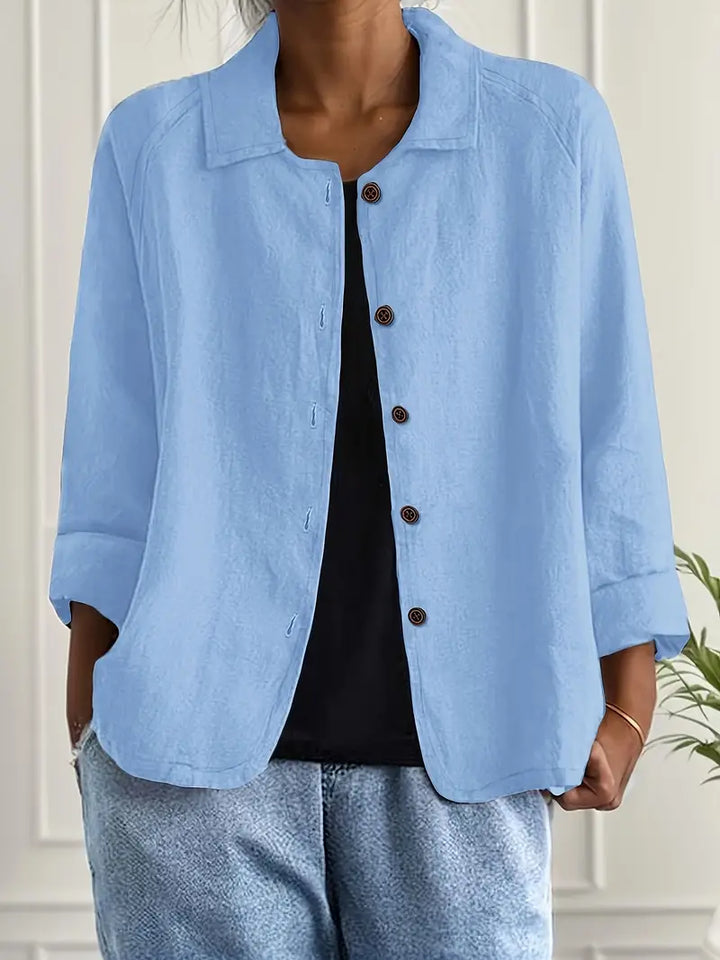 Woman wearing a lightweight classic top on a clean background with a soft flattering fit.