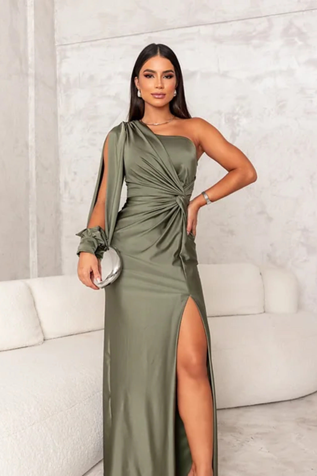 Female model wearing a breathable long dress with graceful drape on a clean background.