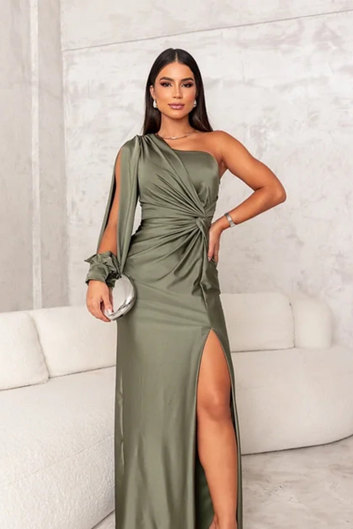Female model wearing a breathable long dress with graceful drape on a clean background.