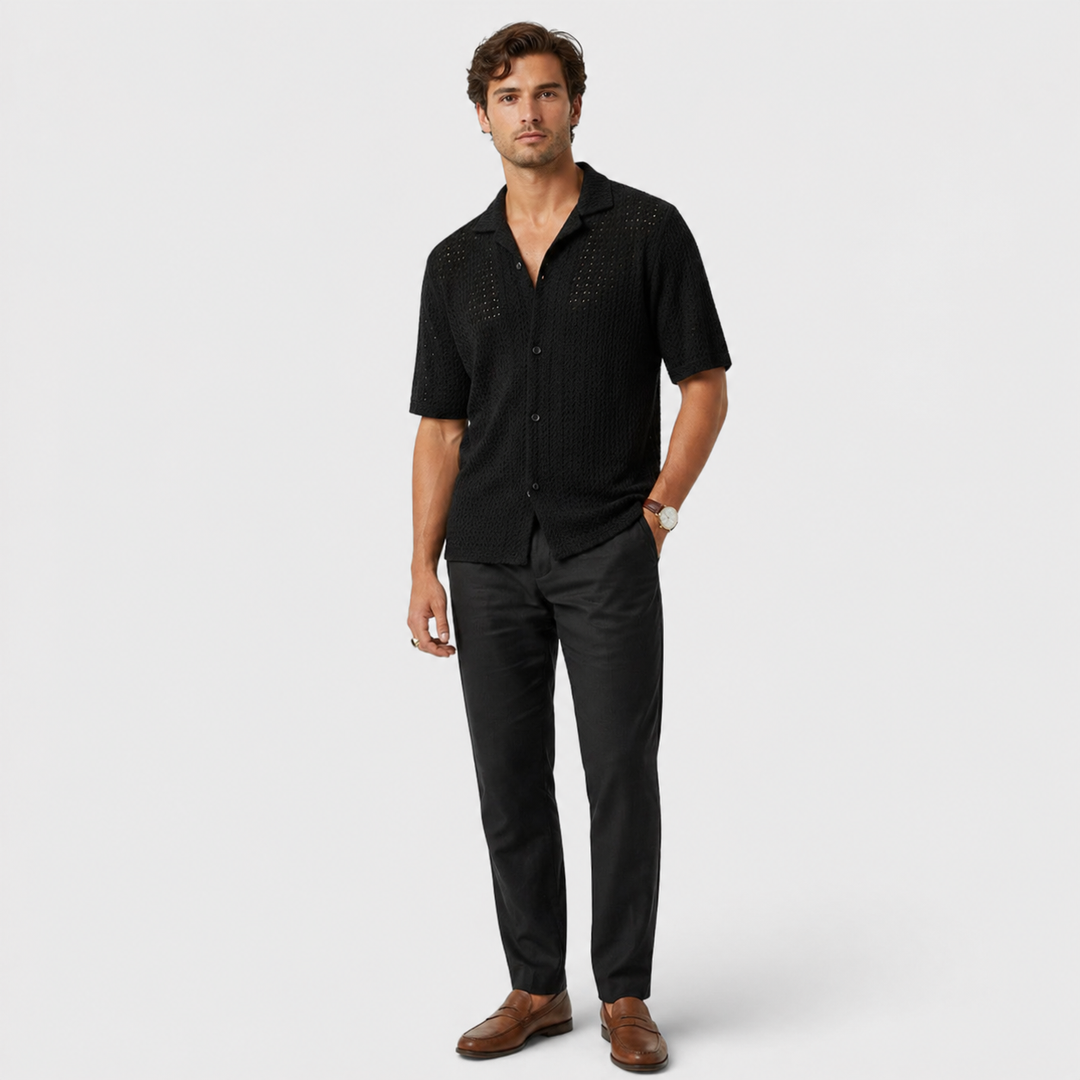 Male model in a relaxed summer shirt with a polished casual silhouette.