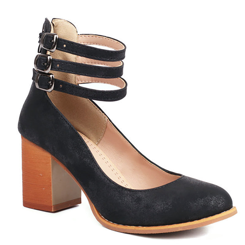 Minimalist heel sandal in a plain studio background.