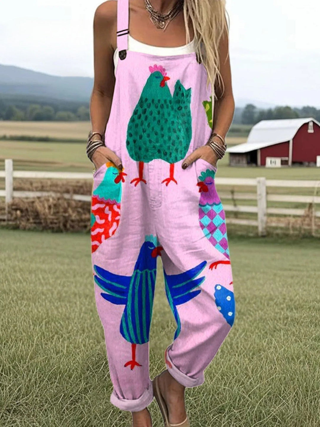 Woman posing in a relaxed fit jumpsuit with playful details on a nature  backdrop.