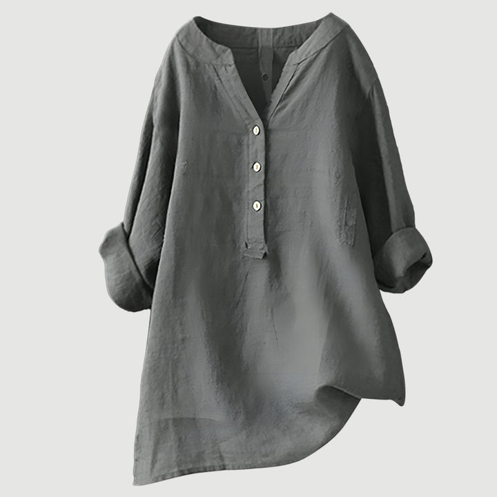 Elegant flowing tunic top for everyday wear on a clean background.