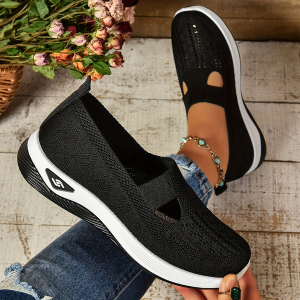 Female model wearing clean slip-on shoes with a modern casual look.