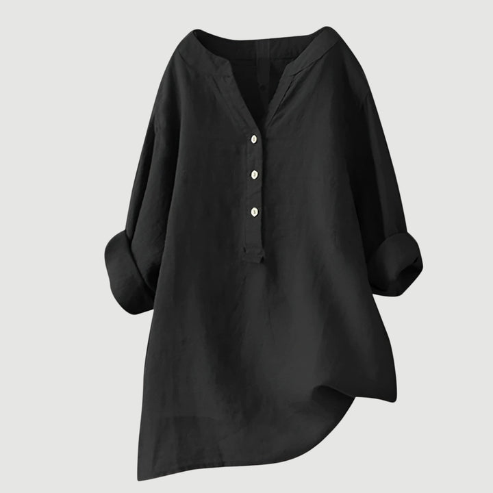 Women’s casual button tunic styled with a clean minimal background.