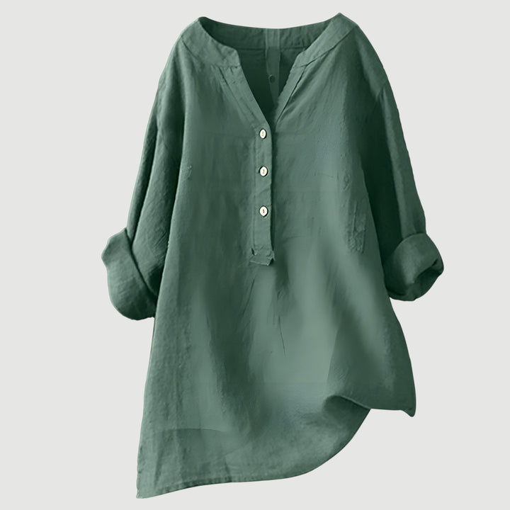 Flattering loose fit tunic top worn against a clean studio background.