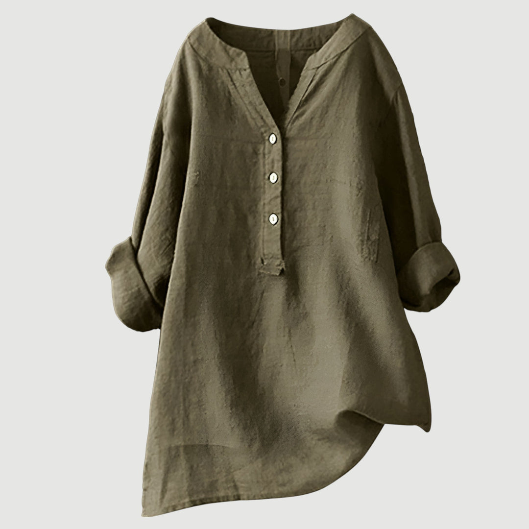 Button detail tunic top for women styled on a plain background.