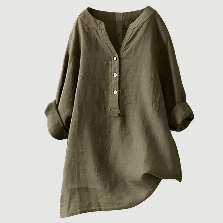 Button detail tunic top for women styled on a plain background.