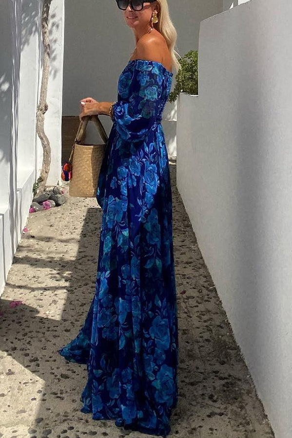 Woman showcasing a breezy floral maxi dress with off-shoulder neckline.