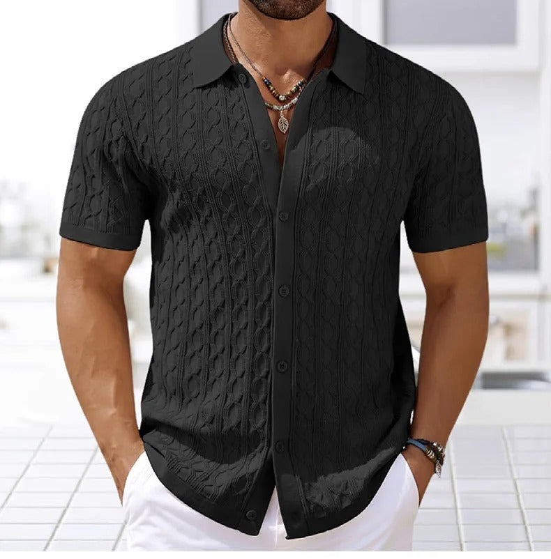 Male model wearing a modern textured polo shirt on a plain background.