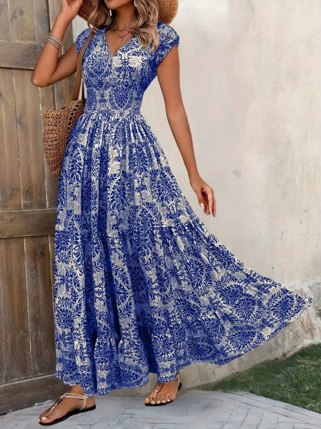 Woman styled in a V-neck boho maxi dress with layered skirt