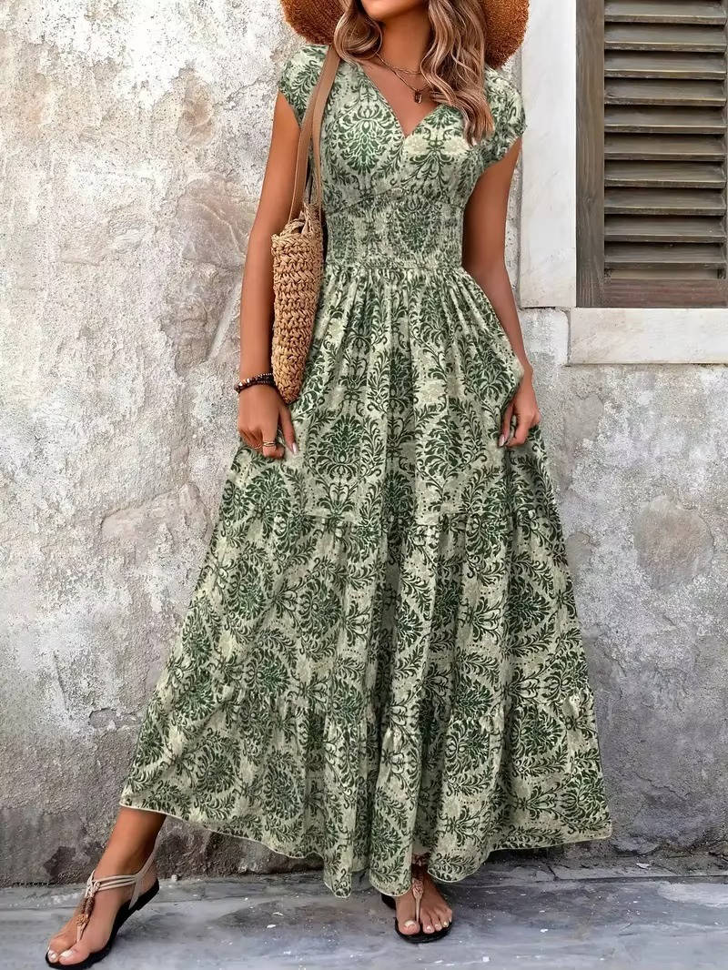 Fashion model wearing a relaxed fit boho dress against a clean plain background
