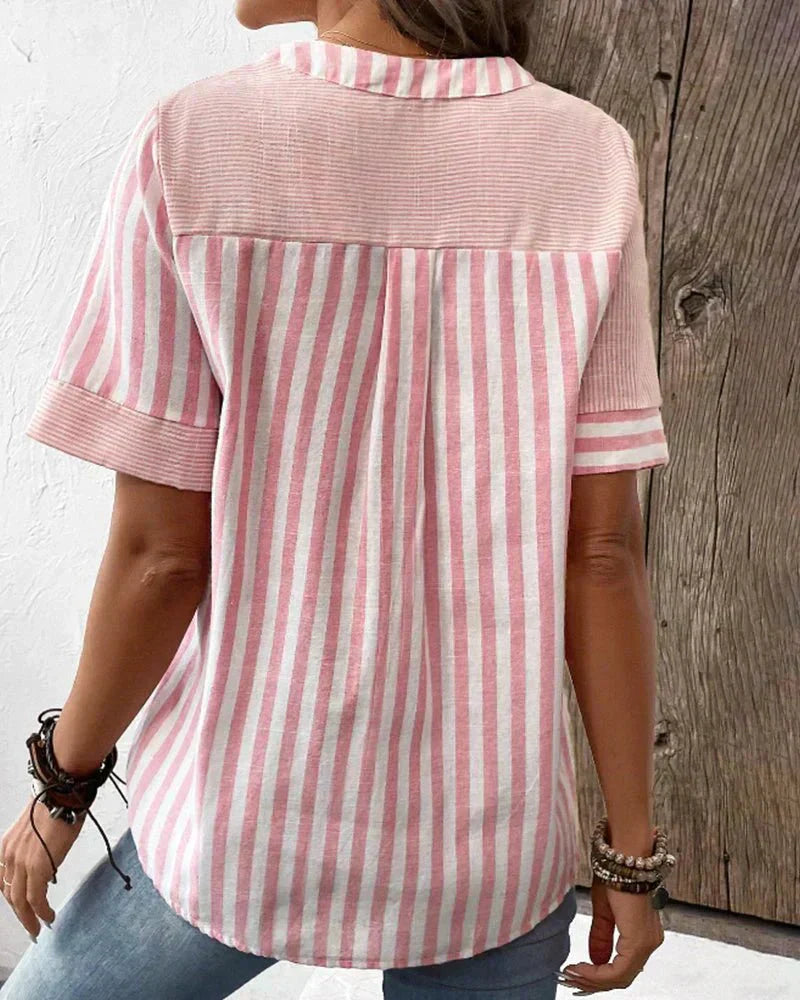 Lightweight striped blouse styled with a wearer on a plain background, back view