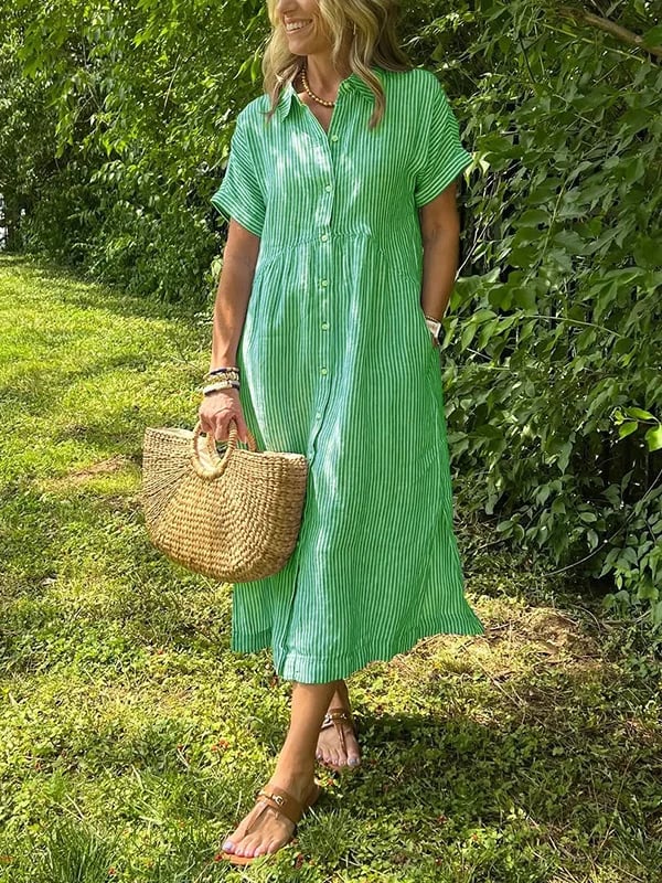 Long striped button shirt featured w/ model against a green background.