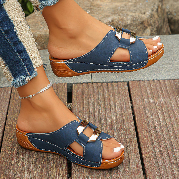 Model showcasing breathable buckle sandals on a clean background.