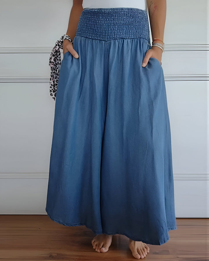 Women’s elastic waist pants on a plain background.