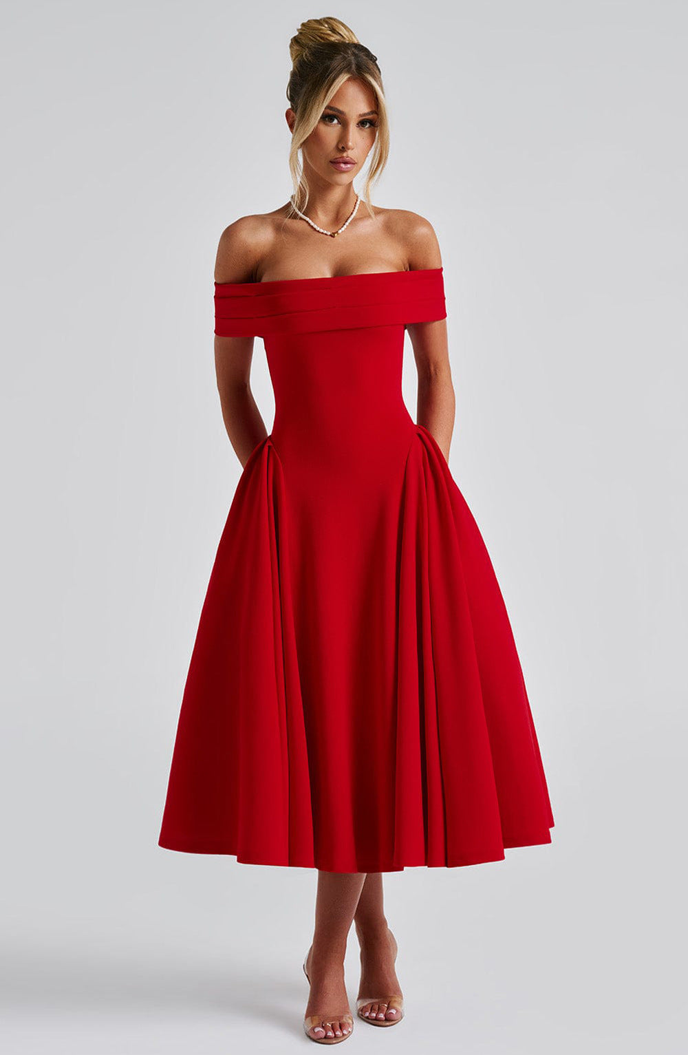 Model wearing a timeless off-shoulder A-line dress on a clean background.