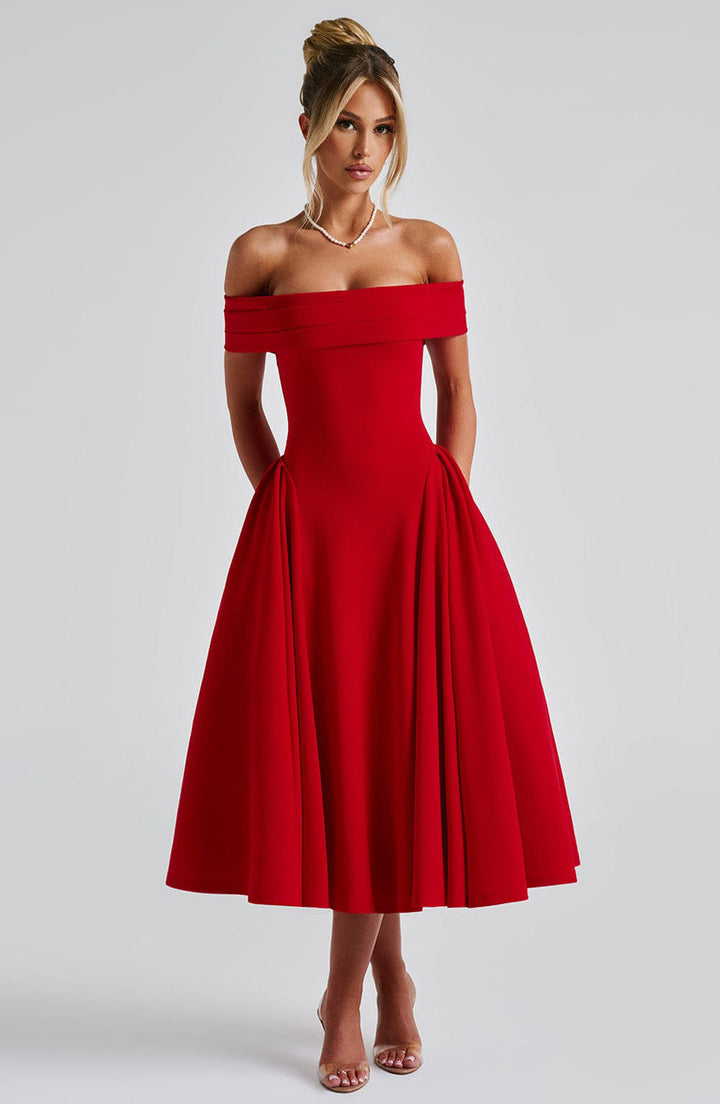 Model wearing a timeless off-shoulder A-line dress on a clean background.