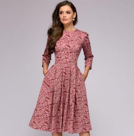 Female in a spring floral A-line dress displayed on a clean background.