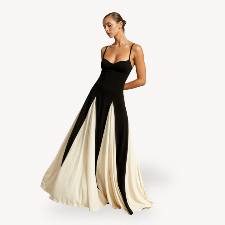 Female wearing black and ivory satin maxi dress on a plain background.