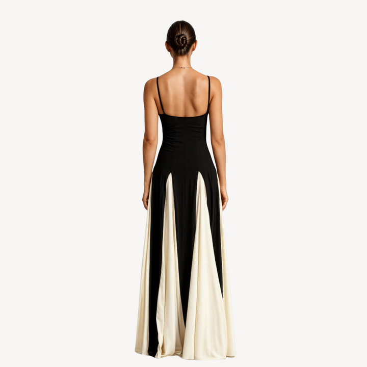Woman in flowing satin maxi dress with fitted bodice on a clean background, back angle view