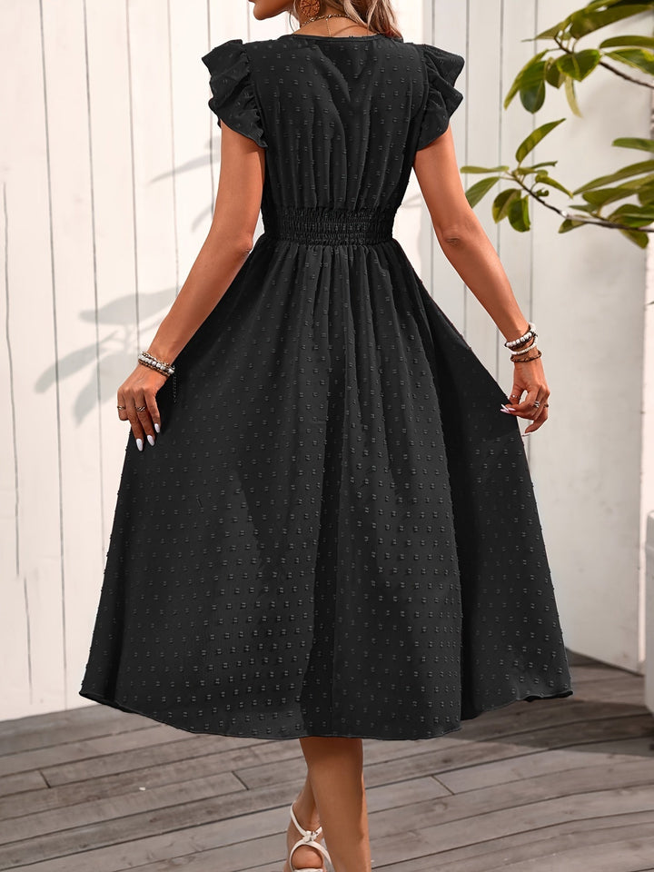 Female in a comfortable V-neck midi dress with ruffle sleeves and casual elegance, back view